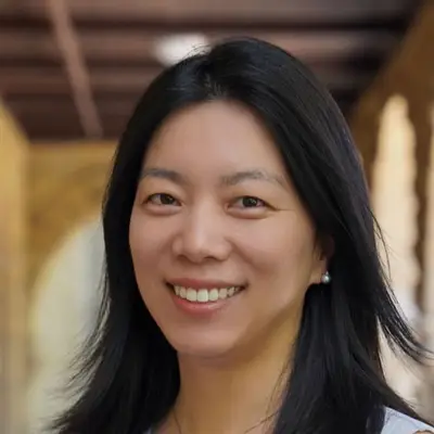 Portrait of Huan Wang, Ph.D., Board Member of BrightUp Kids